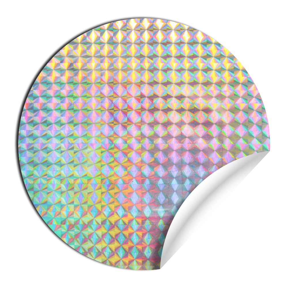 A round holographic sticker with a peeled corner showing a rainbow pattern.