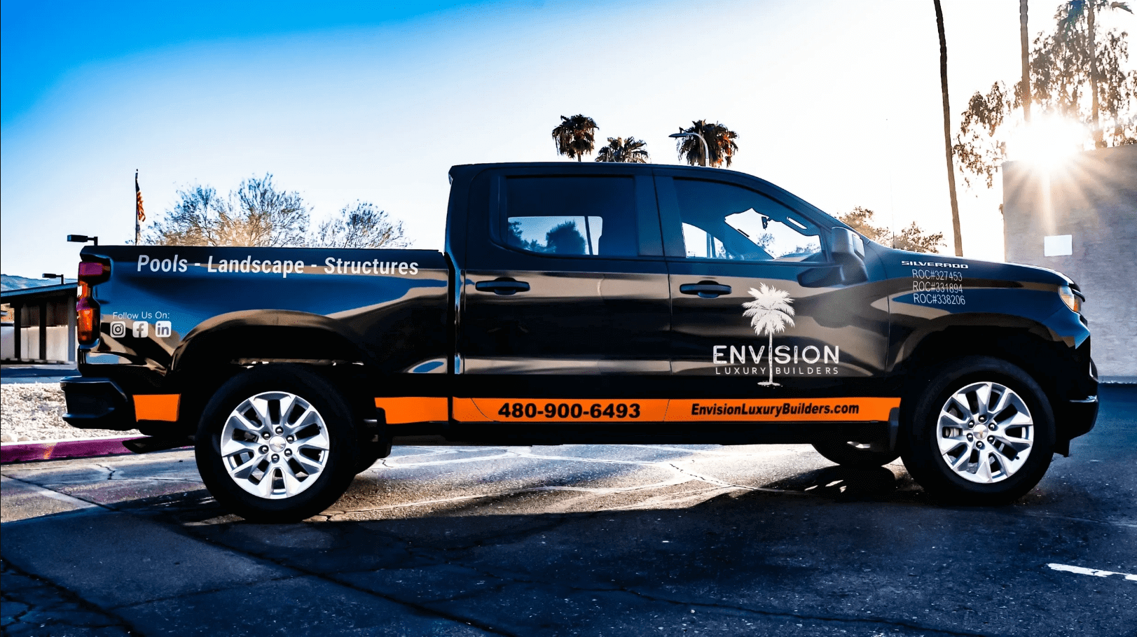 Black pickup truck with Envision logo